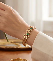 Gold Tone Stainless Steel Butterfly Bangle Bracelet with Green Stone Accents 8063